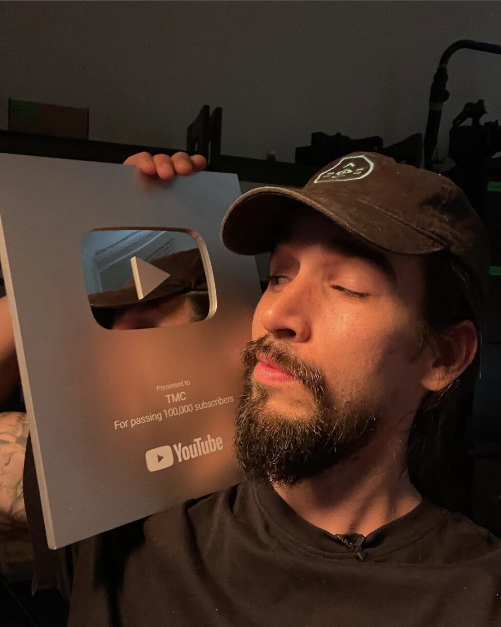 The YouTube silver play button presented to TMC for passing 100,000 subscribers